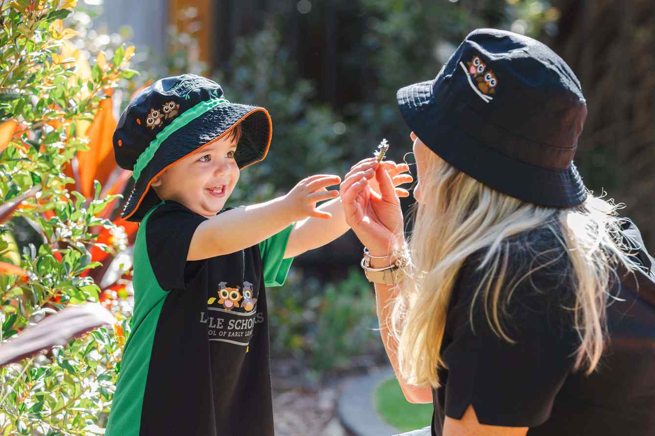 Nursery Early Learning Outdoor Sensory Play with Educator at Little Scholars