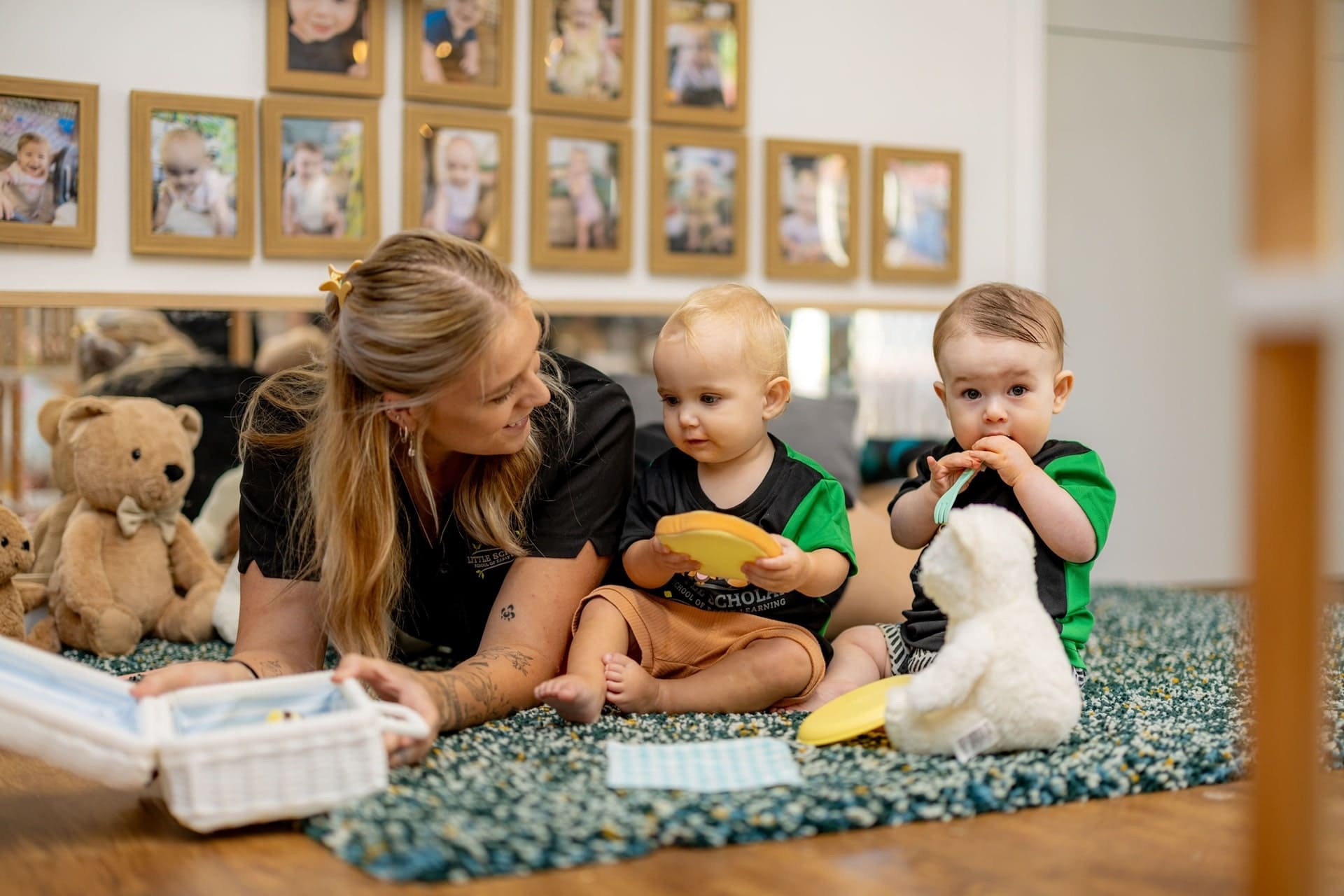 Babies Exploring Sensory Toys With Their Educator At Little Scholars Early Learning Centre