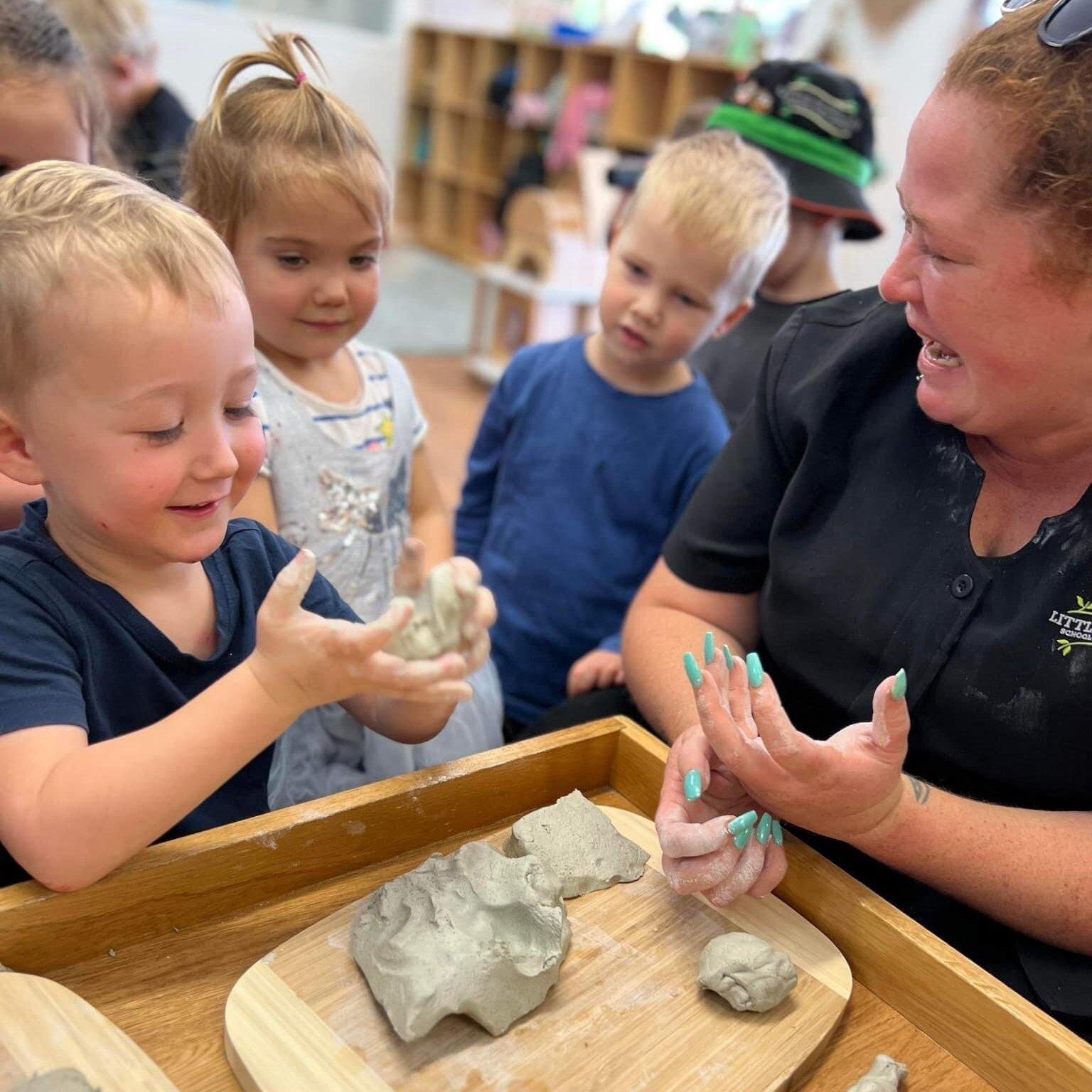 Little Scholars and educator playing clay